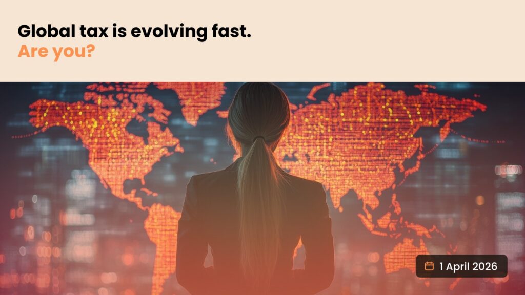 Person in a business suit facing a glowing digital world map, illustrating fast-changing global tax and the global minimum tax